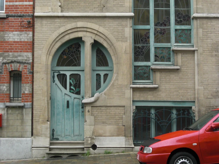 a car parked in front of a brick building