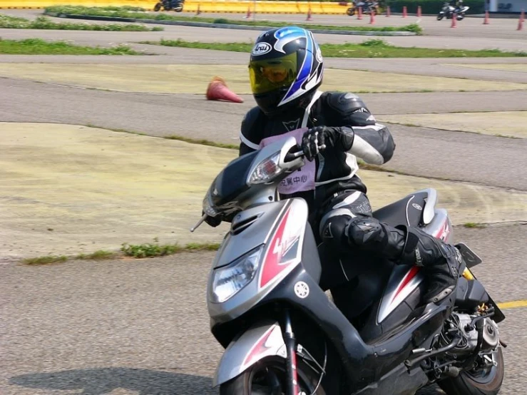 the man rides his motorcycle on the road