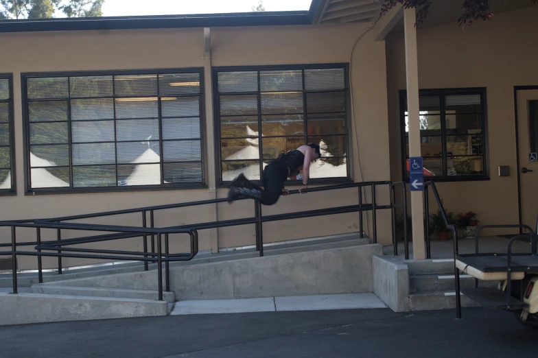 a man is doing a skateboarding trick outside