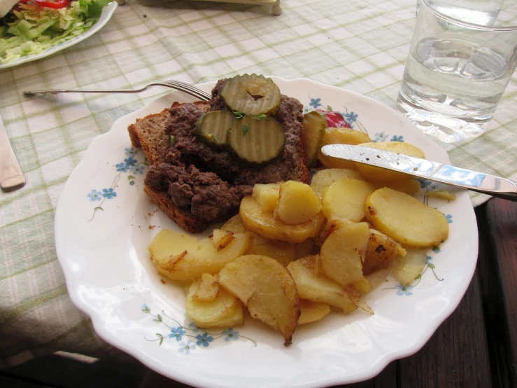 a plate of food with a fork and knife on the side