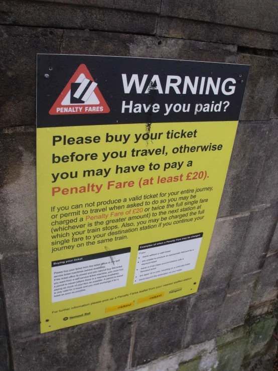 a sign warning people to have paid to travel