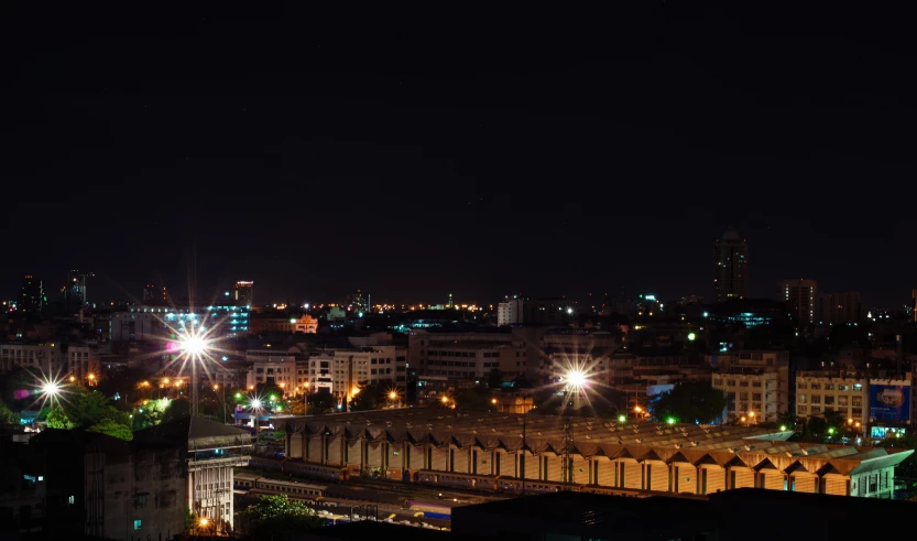 a large city lit up by night time lights