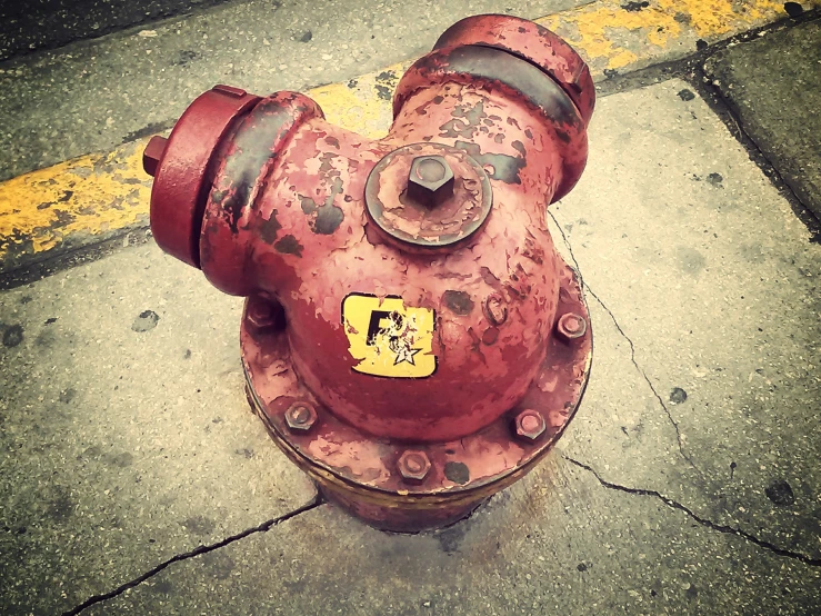 a rusted red fire hydrant sitting on a sidewalk