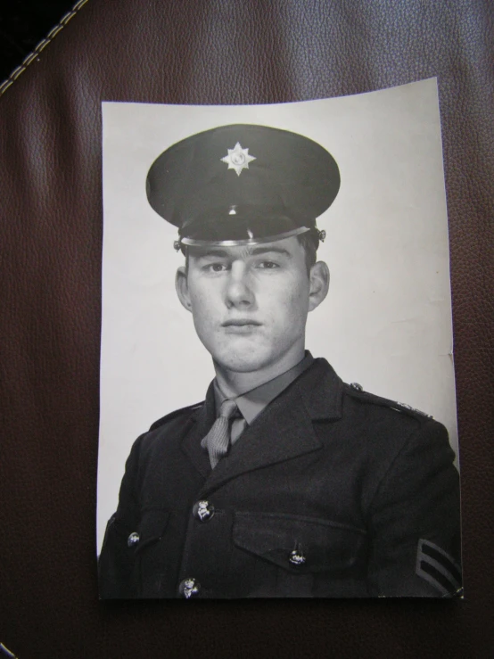 a vintage black and white po of a soldier