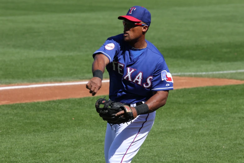 the baseball player is getting ready to throw the ball