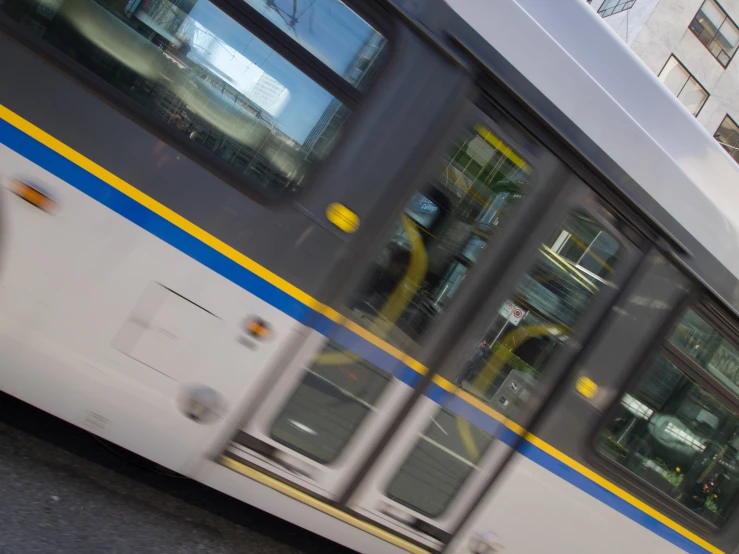 a city bus in motion on the road