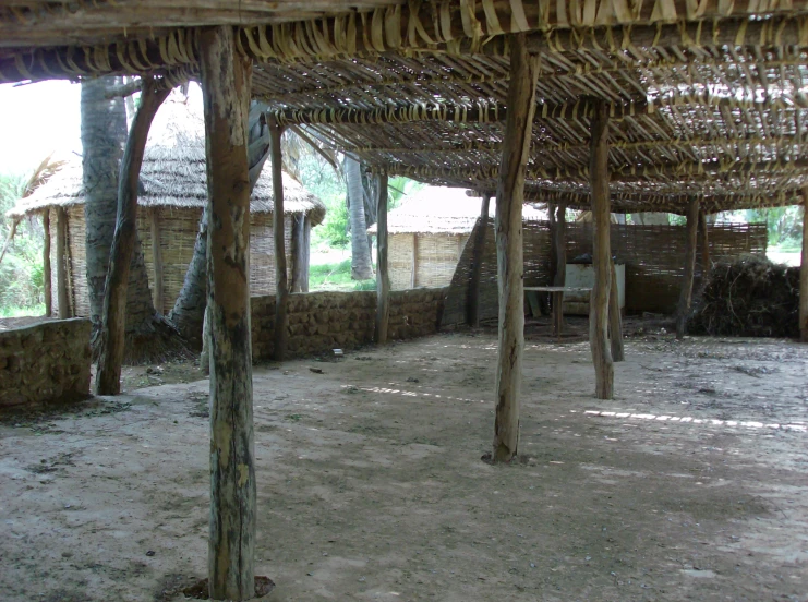 an open outdoor patio with lots of wooden structures