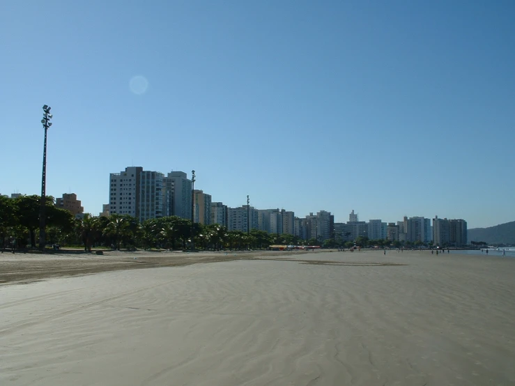 the beach and skyline are near a city