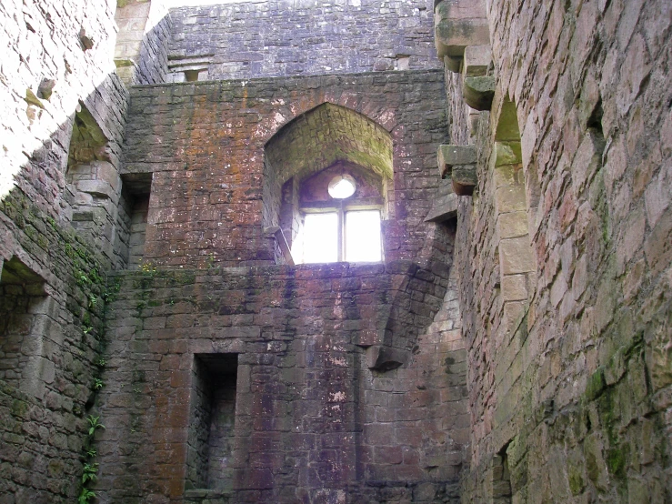 there is a window in the stone wall