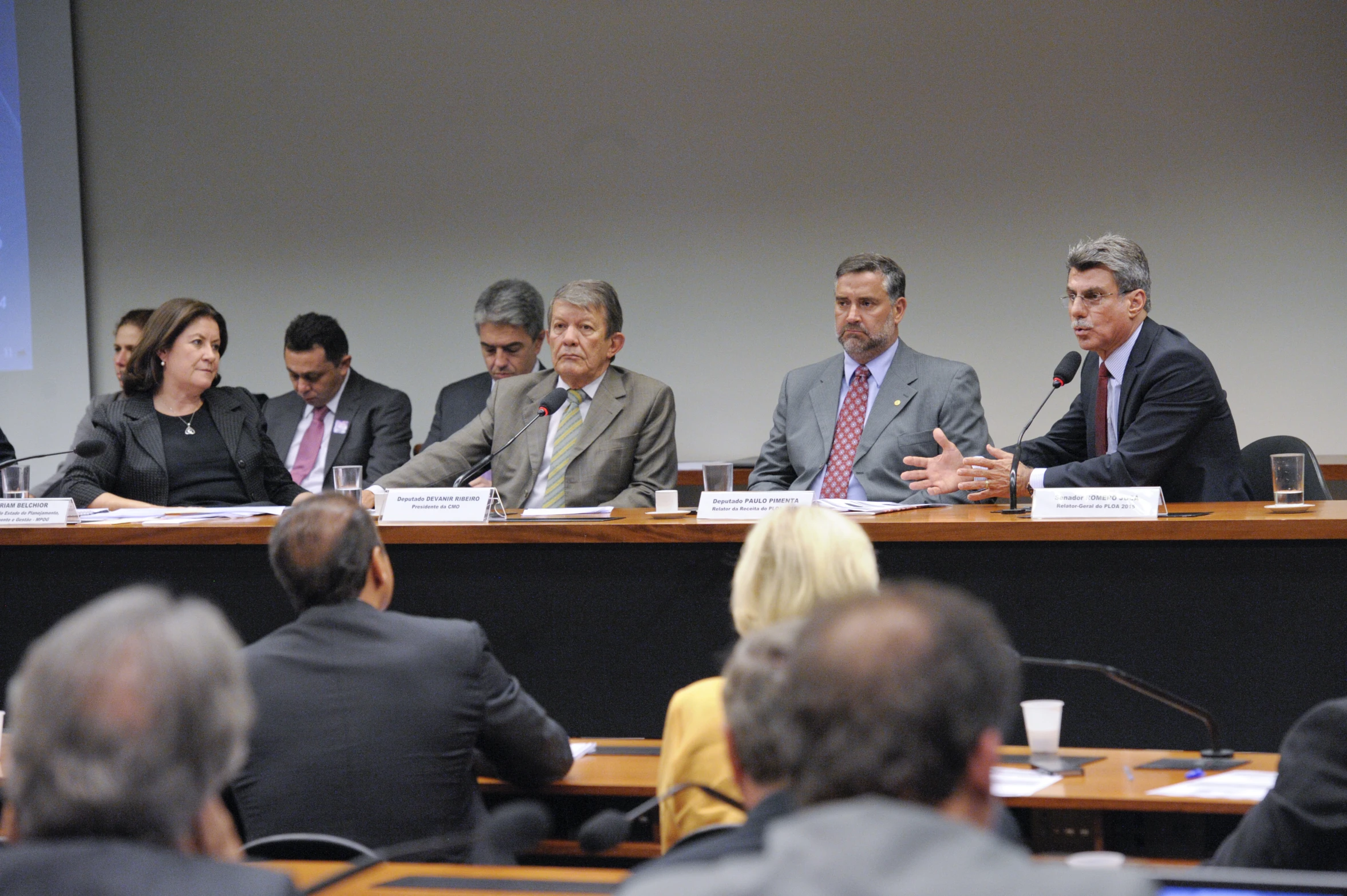 a group of people at a conference during the day