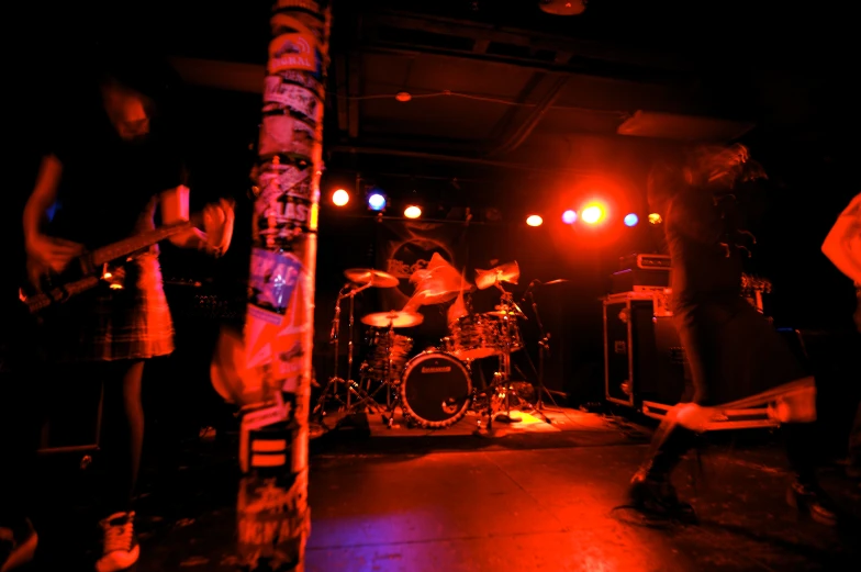 a group of people on stage performing and lighting