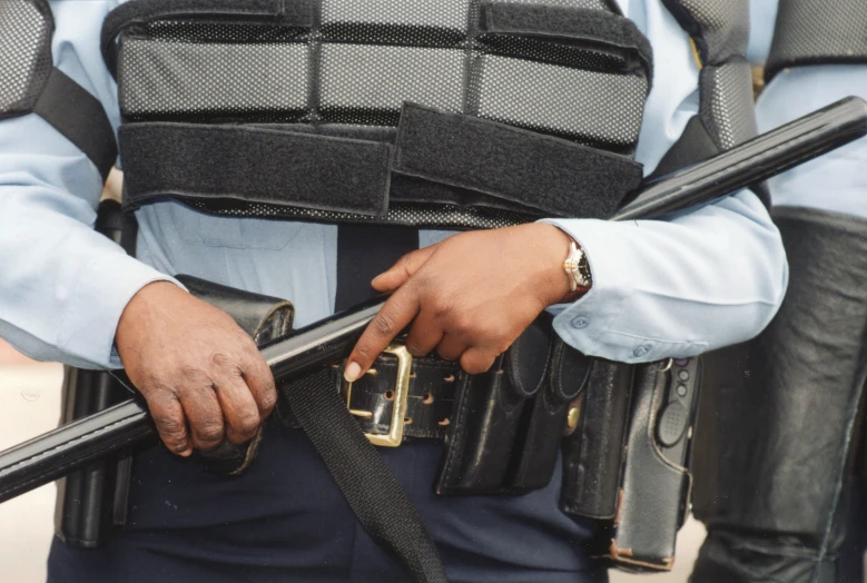 a police man with a gun strapped to his belt