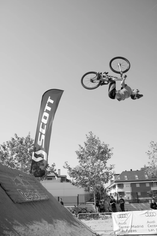 a man is in mid air on his bike