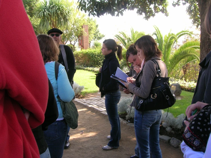 many people are outside on a sunny day