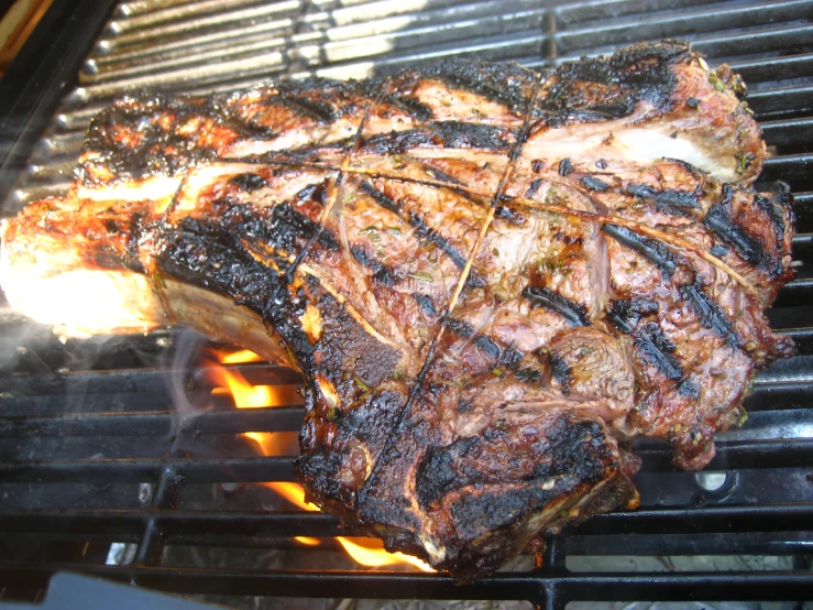 a close up of a steak on a grill
