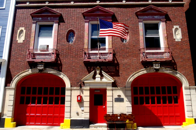 the fire department building is painted red and yellow