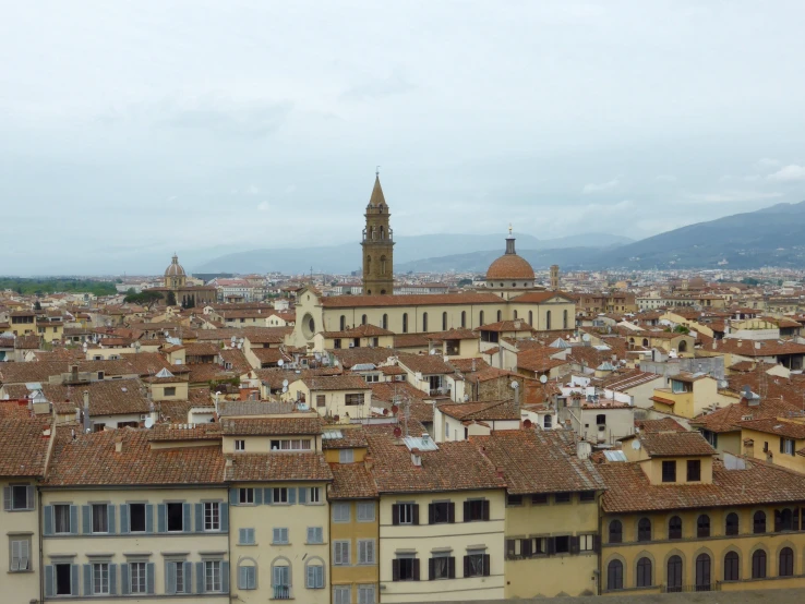 this is an aerial view of some buildings and a large tower