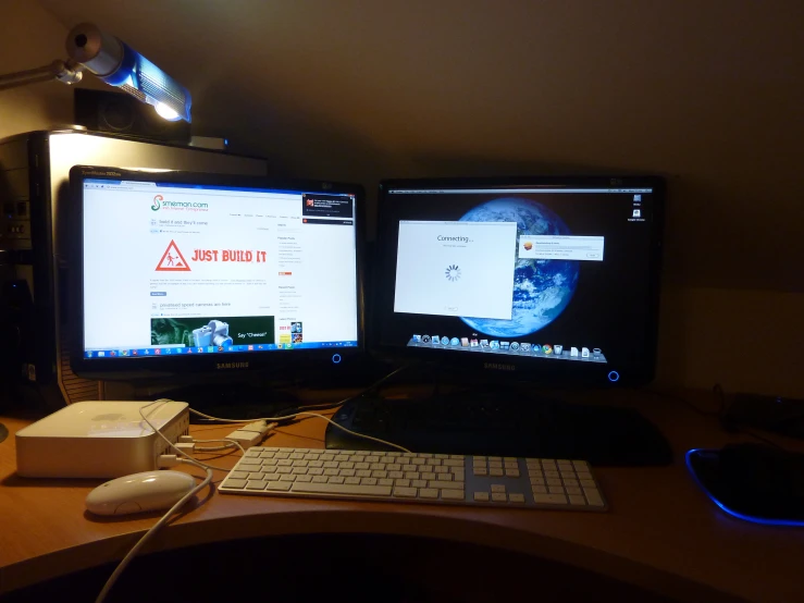 two computer monitors sit next to each other on a desk