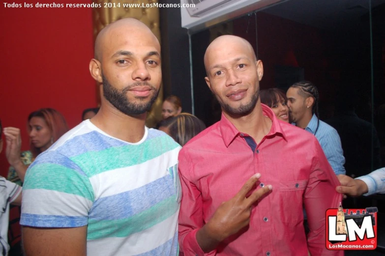 two men who are smiling together for the camera