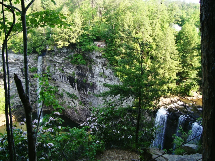 the tall waterfall is seen from the other side