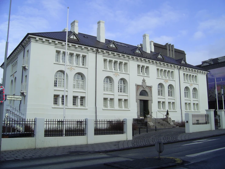 an old building on the corner of the street