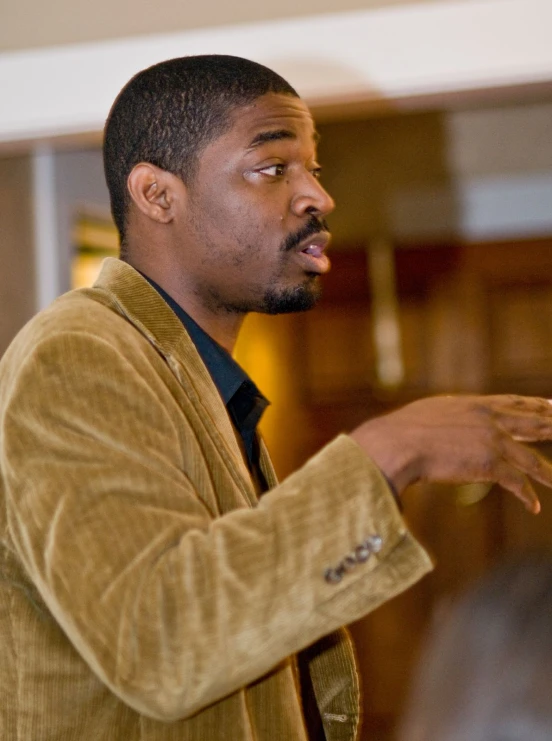 a man talking at a podium about soing