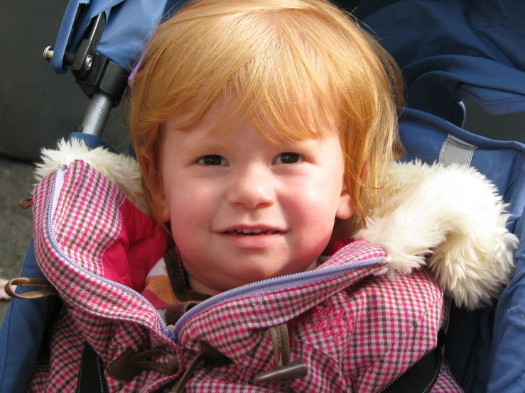 a young child who is looking directly into the camera