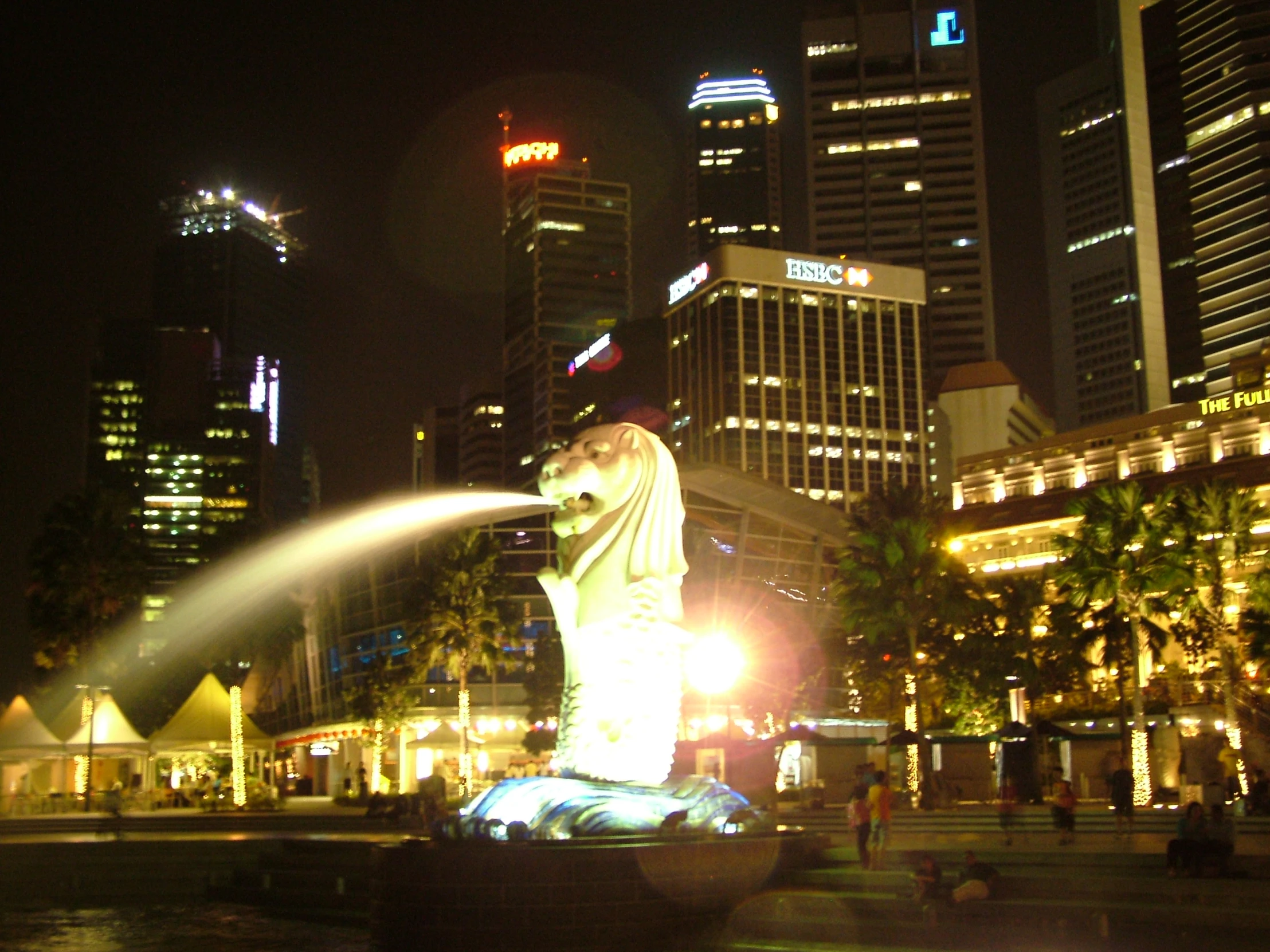 a fountain of water in front of a city