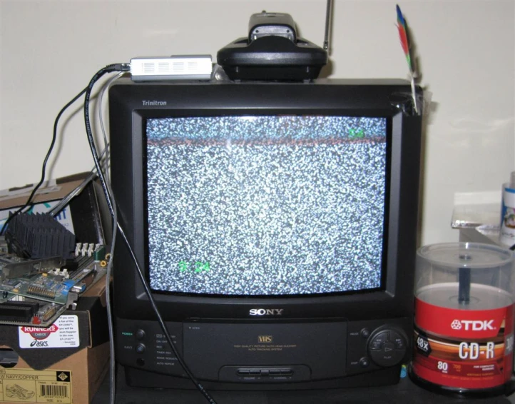 an old fashioned tv is on top of a table