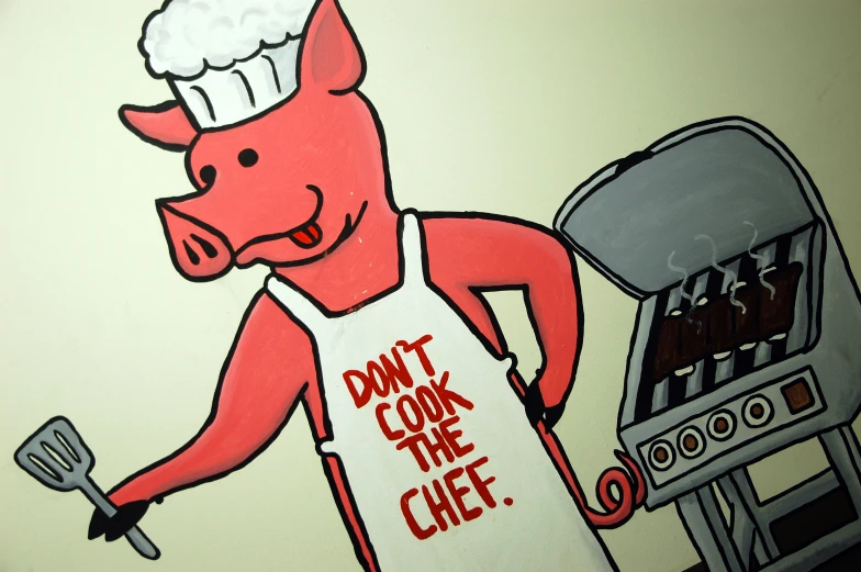 a pig in a cooking apron is holding a grill