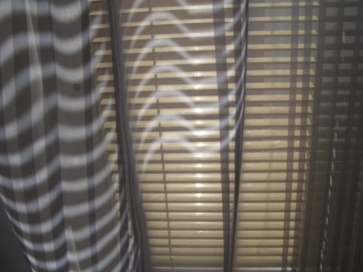 a striped curtains that looks like they've come out from a window