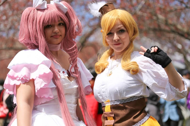 two woman in costumes posing for the camera