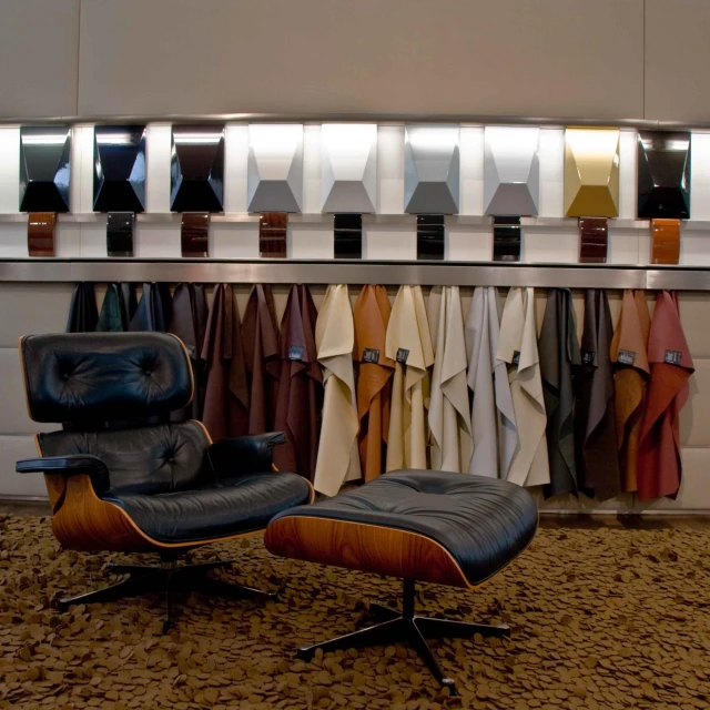 a room with a chair and shirts hanging