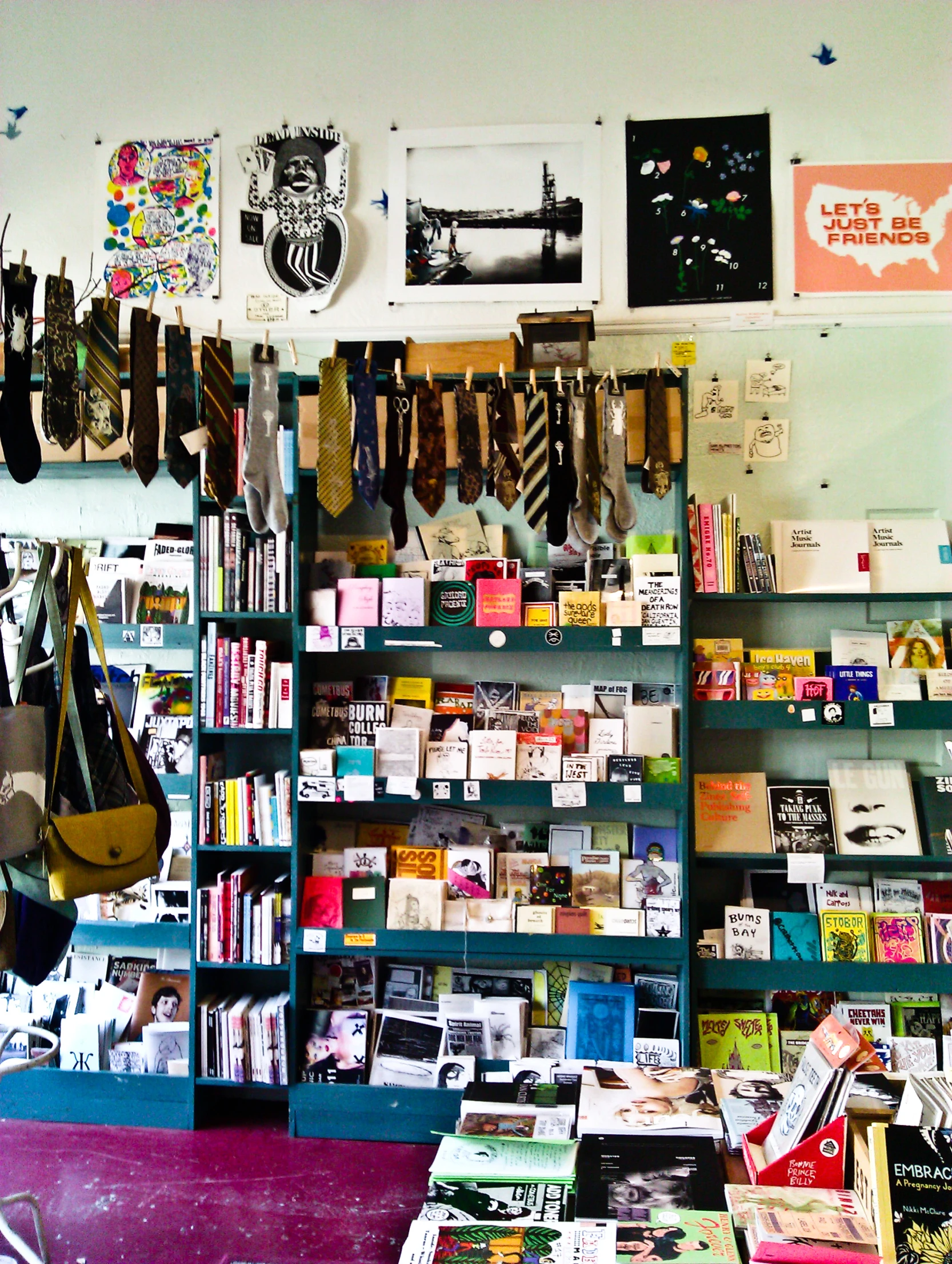 a bookshelf full of various books and accessories