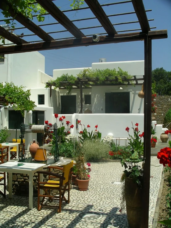 the outdoor patio is lined with potted plants and flowers
