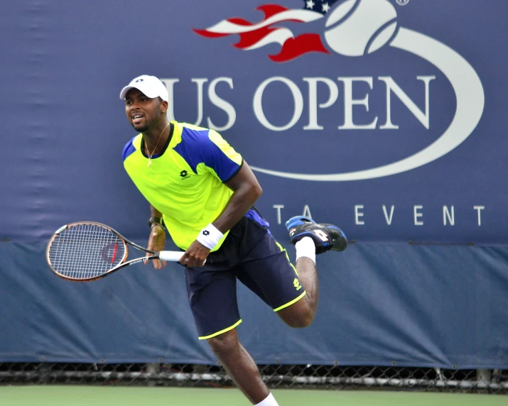 a tennis player is moving across the court