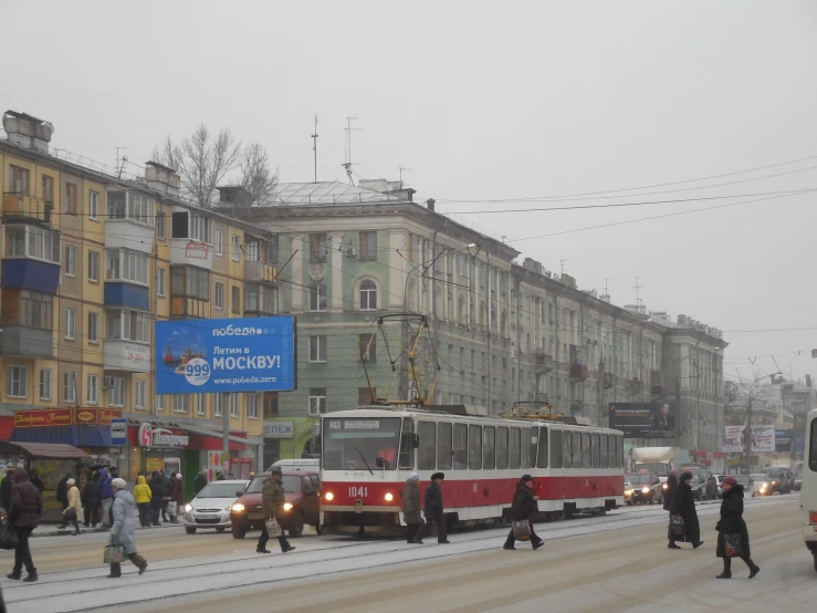 people are walking in a busy street in a large city