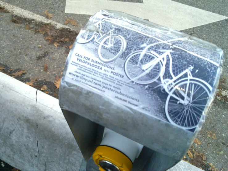 a parking meter on the curb next to a street