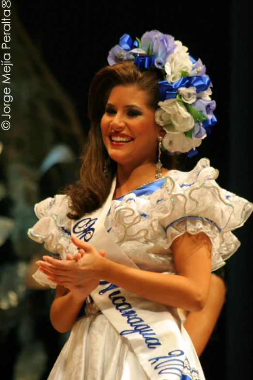 the young woman is dressed in a costume and is dancing