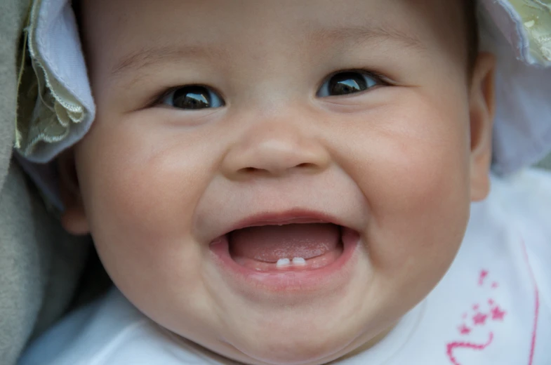 an adorable baby with a hat and some clothing