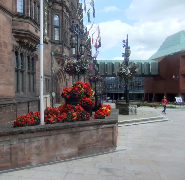 flower arrangements along the edge of an empty plaza