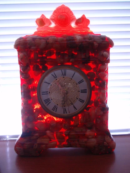 a clock made out of candy sits on a table