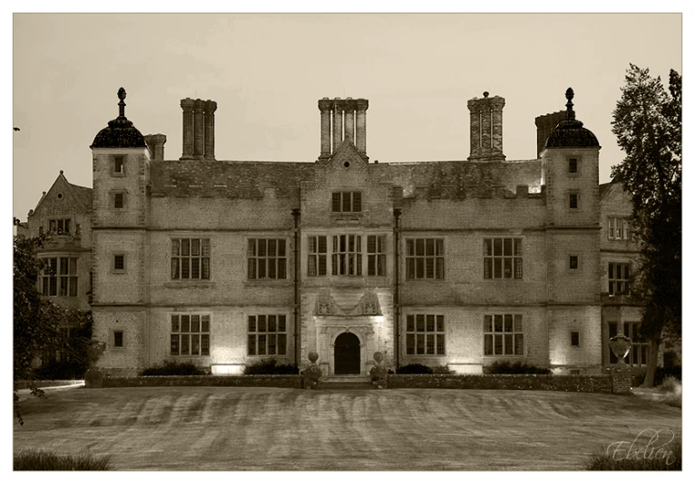 large, tall castle like building with an entry way in the middle