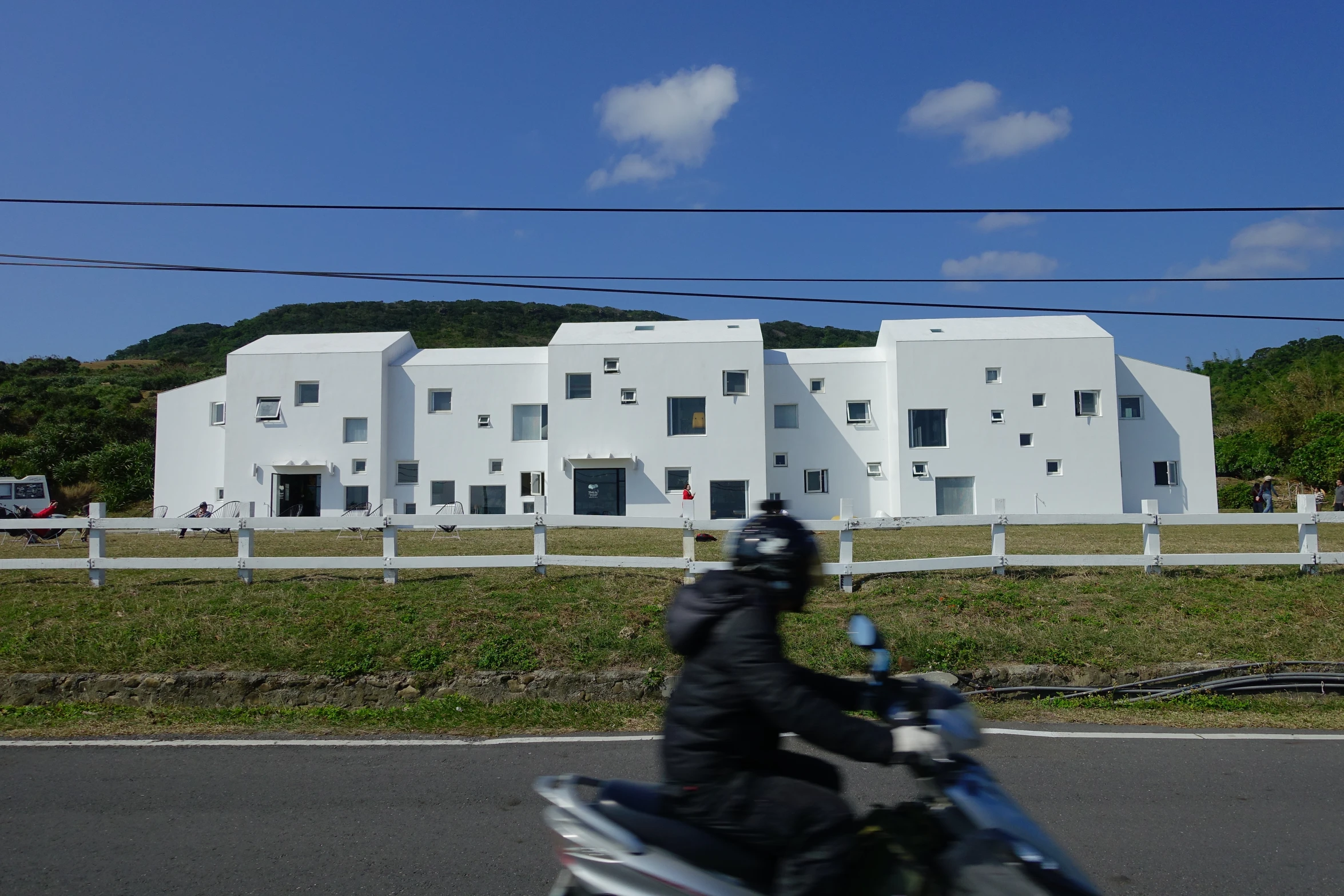 a person riding a motorcycle down a street