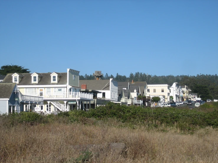 a small town with many balconies and cars