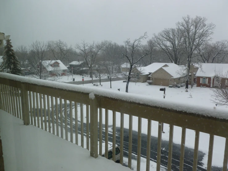 a view from a balcony on a snowy day