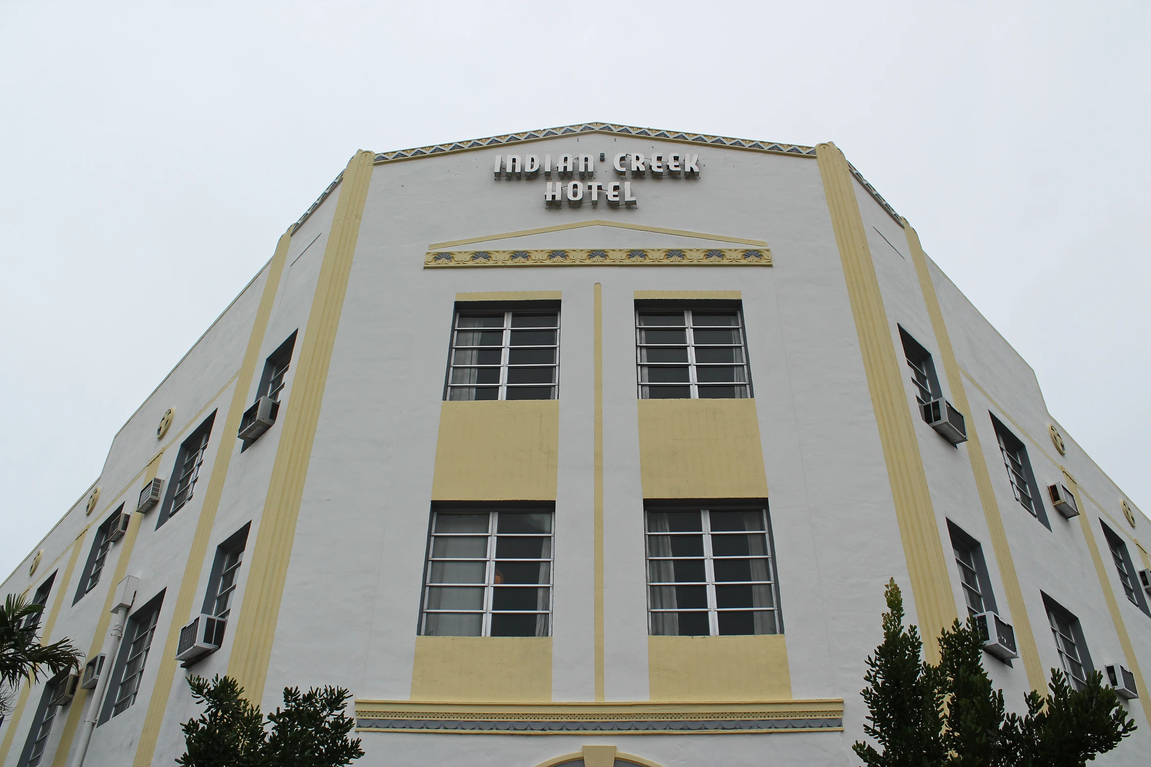 a building with lots of windows and yellow trim