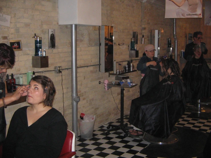 a person  a persons hair in a room with black and white checkered floor