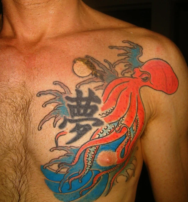 the chest of a man with an octo tattoo on