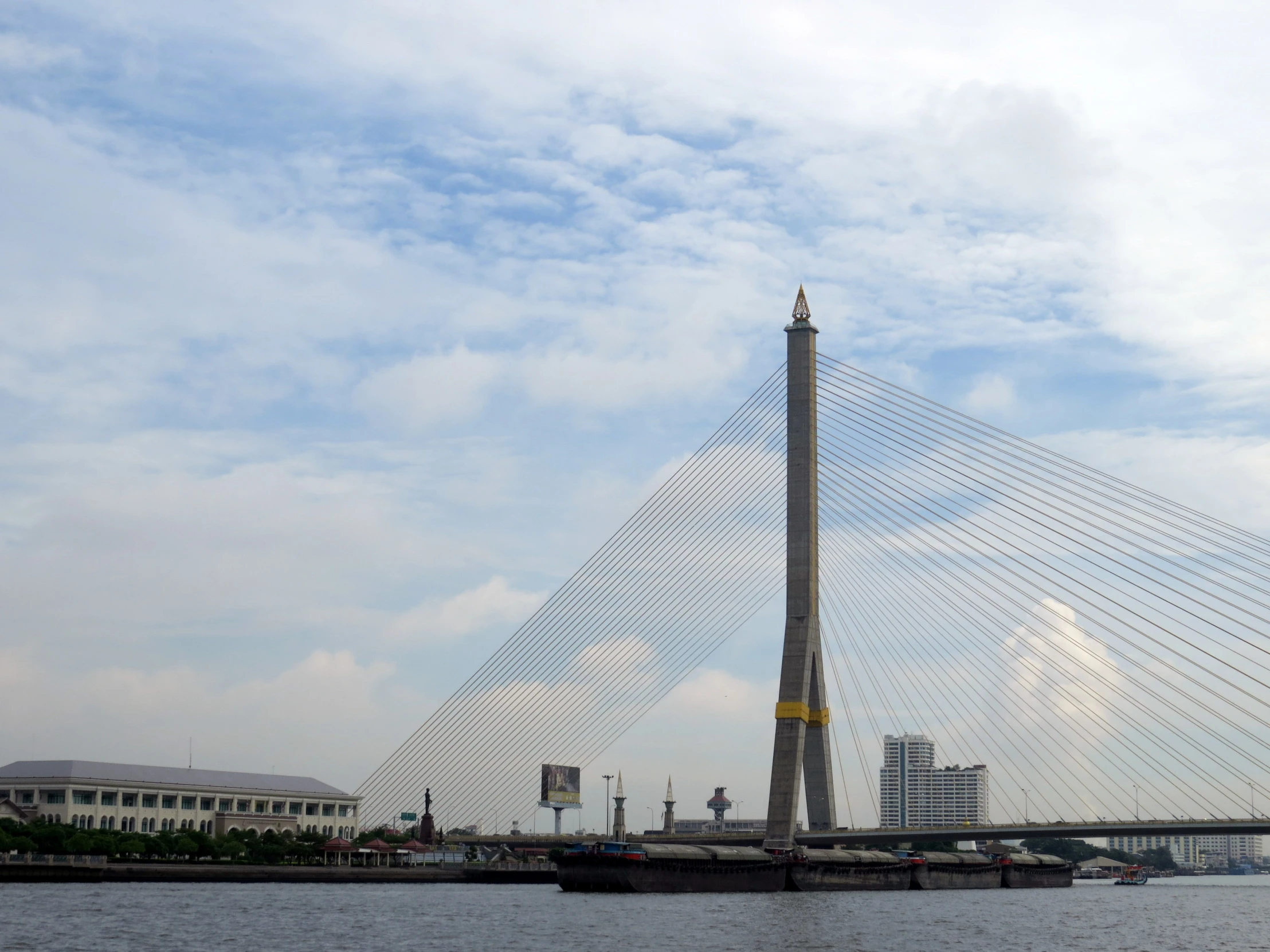 a tall pole sits in the middle of the water